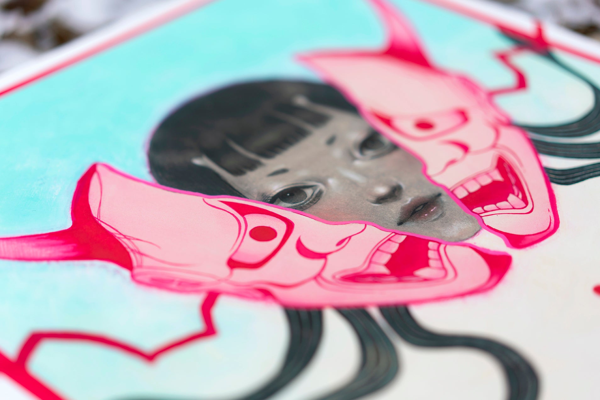 “HANNYA” by Shoko Ishida is an archival pigment print depicting a woman's face partly hidden by joyful and angry pink masks, with flowing black lines on a blue background, channeling the artist’s signature style.