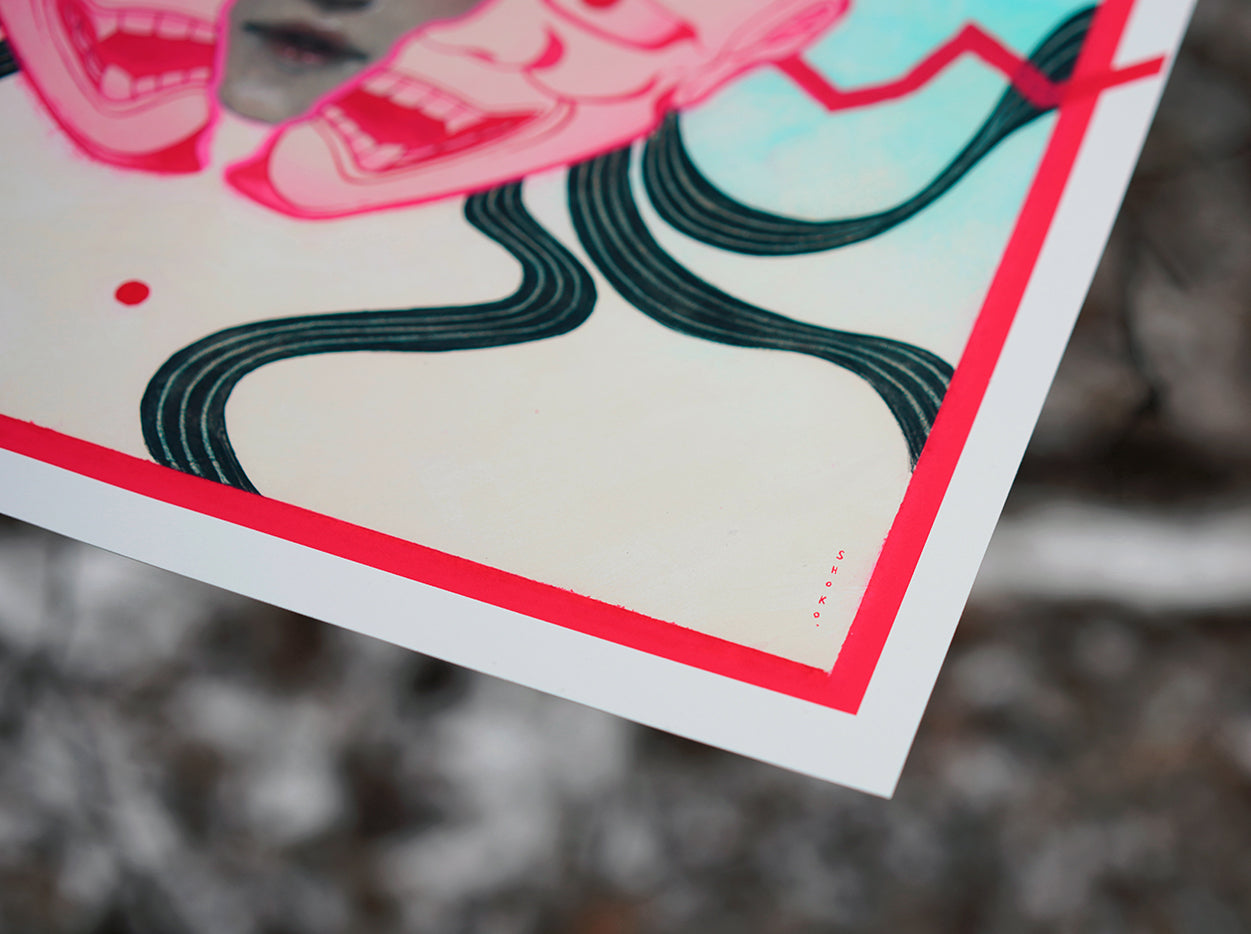 A close-up of "HANNYA" by Shoko Ishida shows bold black wavy lines, a red border, and part of a stylized face on textured paper—an archival pigment print with a blurred background highlighting the detailed edge.