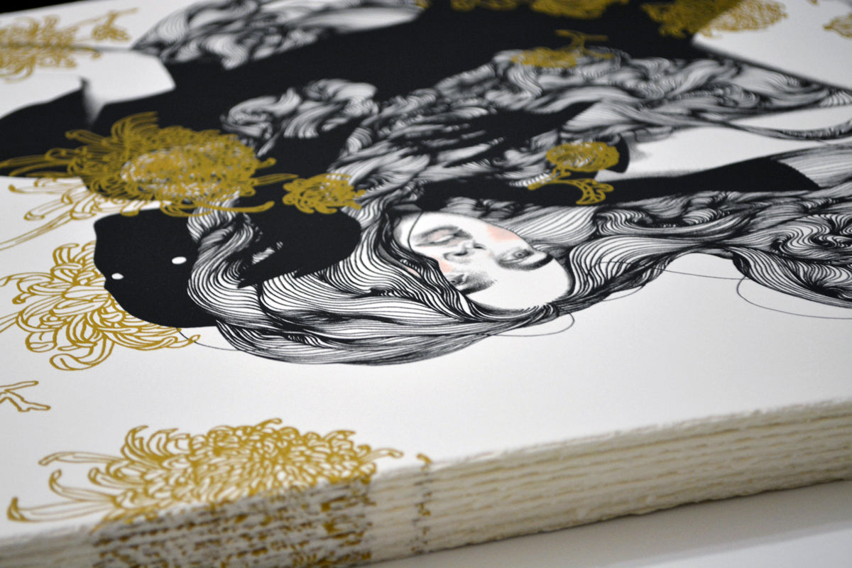 The Yellow Passerby & I by Tran Nguyen is an artistic illustration of a womans face with flowing hair interwoven with golden floral elements on textured paper. This signed, limited edition screenprint beautifully contrasts monochrome simplicity with intricate gold accents.