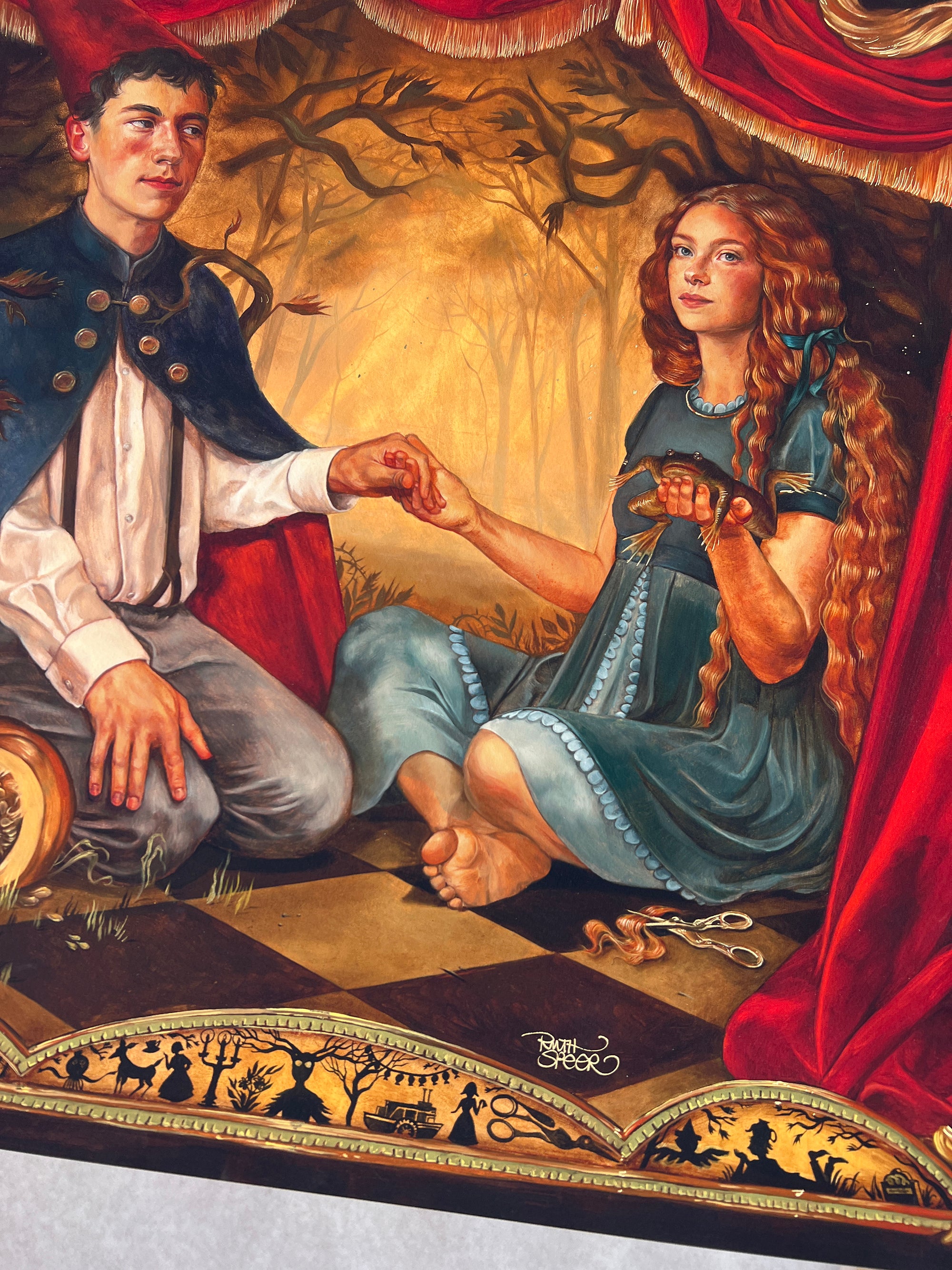 The Portrait of the Unknown by Ruth Speer, an archival pigment print, depicts a young man and woman on a checkered floor under a red curtain. The long-haired woman holds a frog among bare trees and scattered objects like scissors.