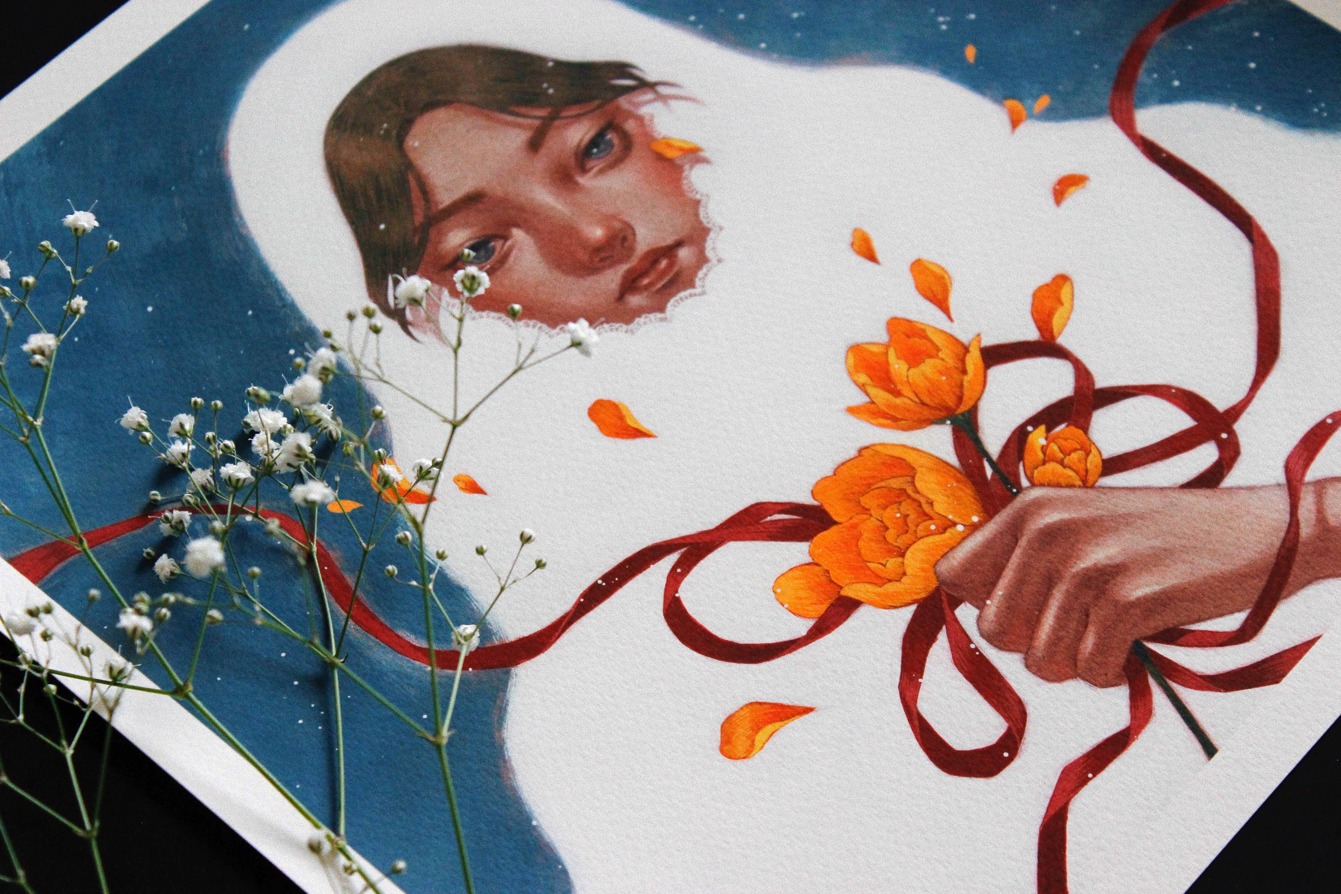 A Winter Bride by Shoko Ishida, she holds orange flowers with a red ribbon, white babys breath delicately resting on top. The deep blue background is reminiscent of an Archival Pigment Print.