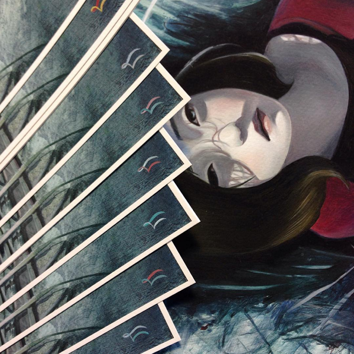 Joanne Nams Lucid is a limited edition painting featuring a woman with closed eyes, surrounded by cards displaying blue and teal abstract patterns, capturing the dreamy, surreal essence of her renowned fine art giclee prints.