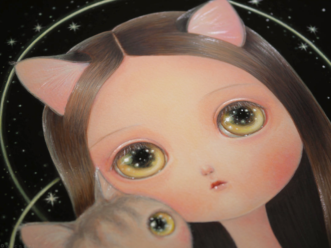 Heart" by aica features a stylized girl with cat ears and shiny yellow eyes holding a matching cat, set against a starry black background with a halo. Each archival pigment print is hand embellished for a unique touch.