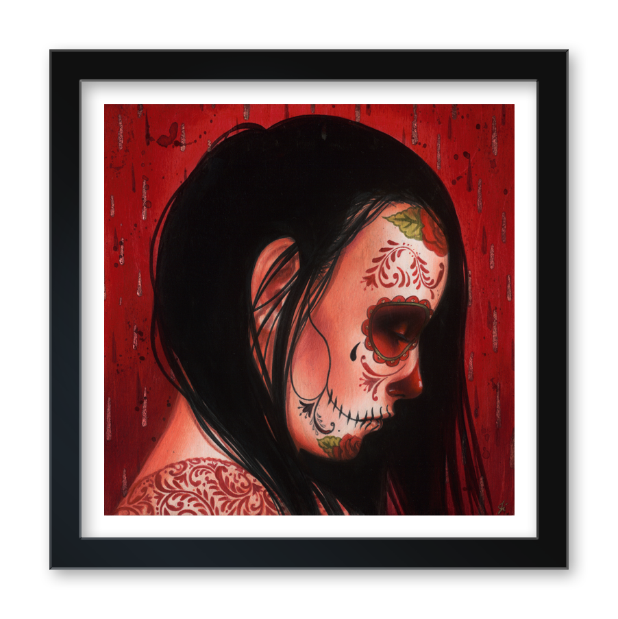 Alma Perdida" (Artist's Proof) by Sylvia Ji features a woman in profile with long dark hair, her face adorned in Day of the Dead sugar skull style and intricate designs, set against a vivid red patterned background. Framed fine art print.