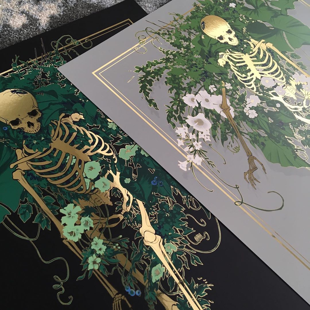 JAW Coopers screenprints, including Fertile Ground, showcase skeletons entwined with nature. Fertile Ground features a dark backdrop with green leaves, while another print has a light background adorned with white flowers. Both artworks have gold accents for a mystical touch.