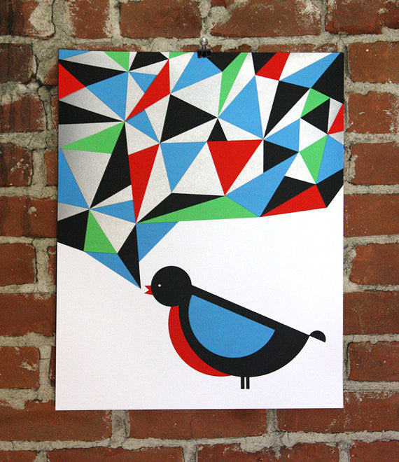 On a brick wall, the Nate Duval Bird 1 screenprint poster features a stylized bird in blue, black, and red, appearing to sing. Above it, metallic silver and multicolored geometric shapes form a speech bubble for a vibrant mosaic effect.