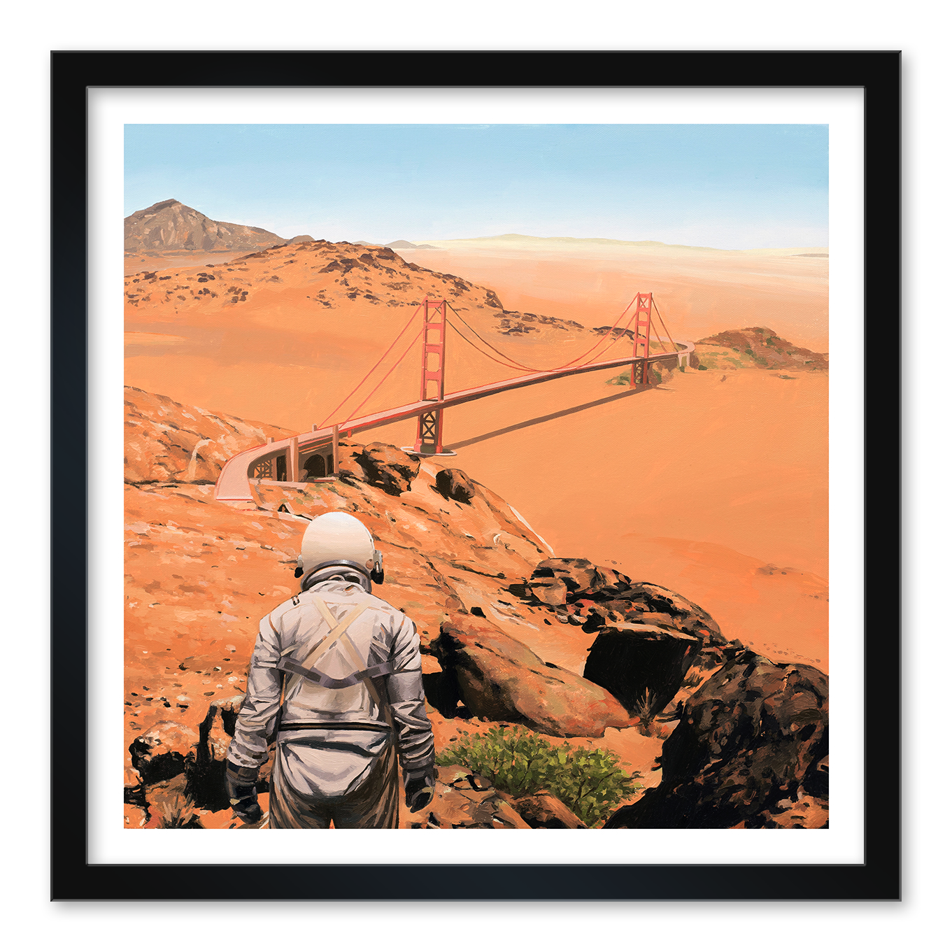 An astronaut stands on a rocky desert facing a half-buried Golden Gate Bridge under a clear blue sky in "The Bridge," an art print by Scott Listfield.