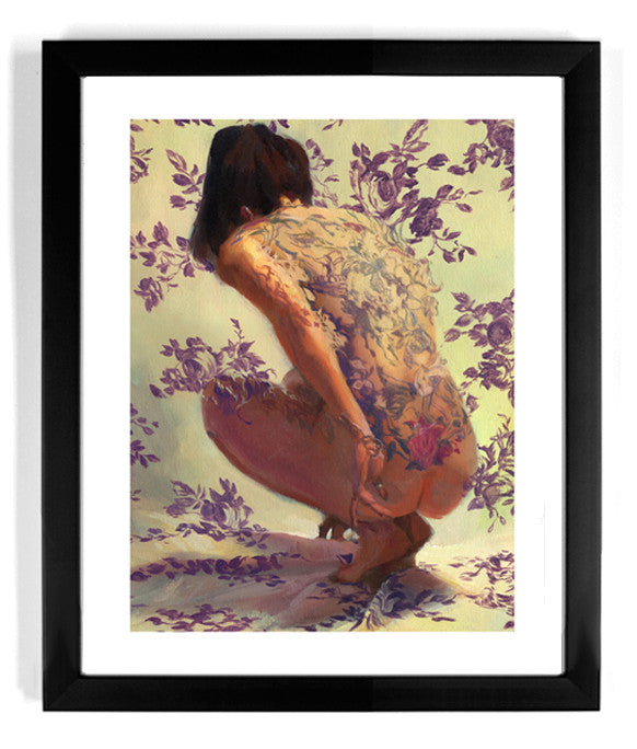 The limited edition framed giclee Tuscany Superb by Sergio Lopez features a person crouching, camouflaged as their skin blends into a floral pattern and matching background, encased in a black frame with a white mat.