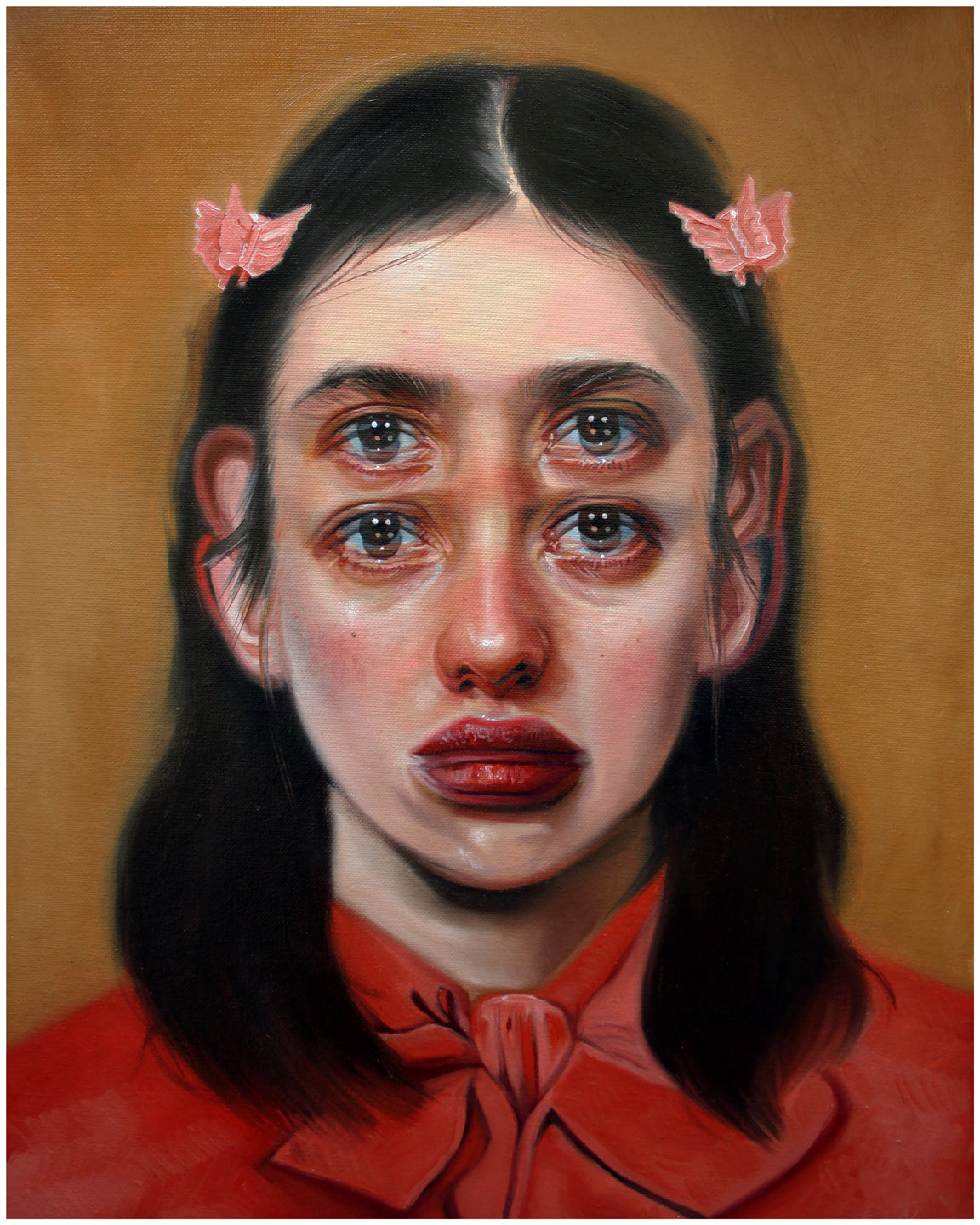 The surreal Passage by Alex Garant is an archival pigment print showcasing a girl in a red shirt with long dark hair and butterfly hair clips. She has an extra set of eyes, enhancing the dreamlike effect, on a muted brown background. This print is signed and numbered.