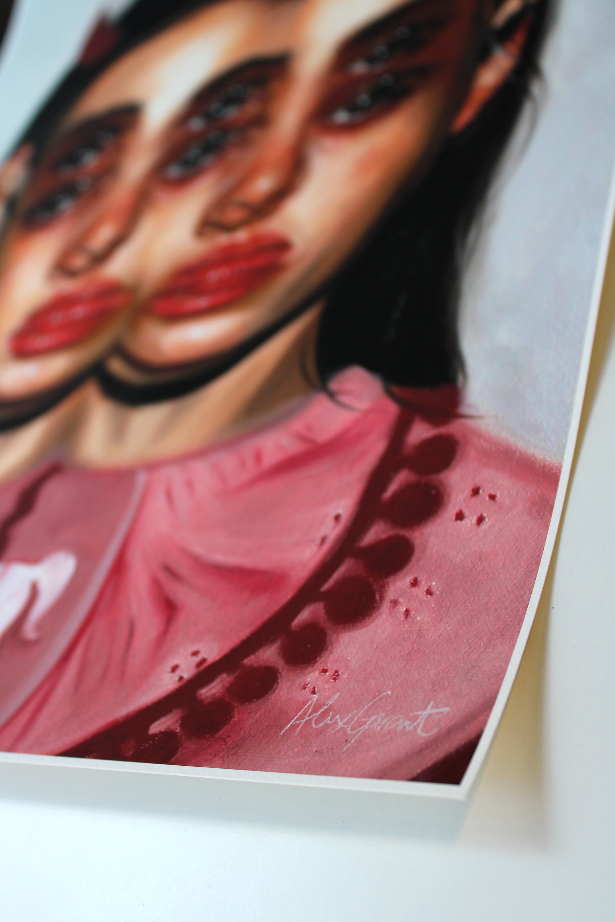 Alex Garants Carousel is a surreal archival pigment print depicting a womans face with overlapping eyes and lips, wearing a pink garment with dark circles, capturing a whimsical essence.