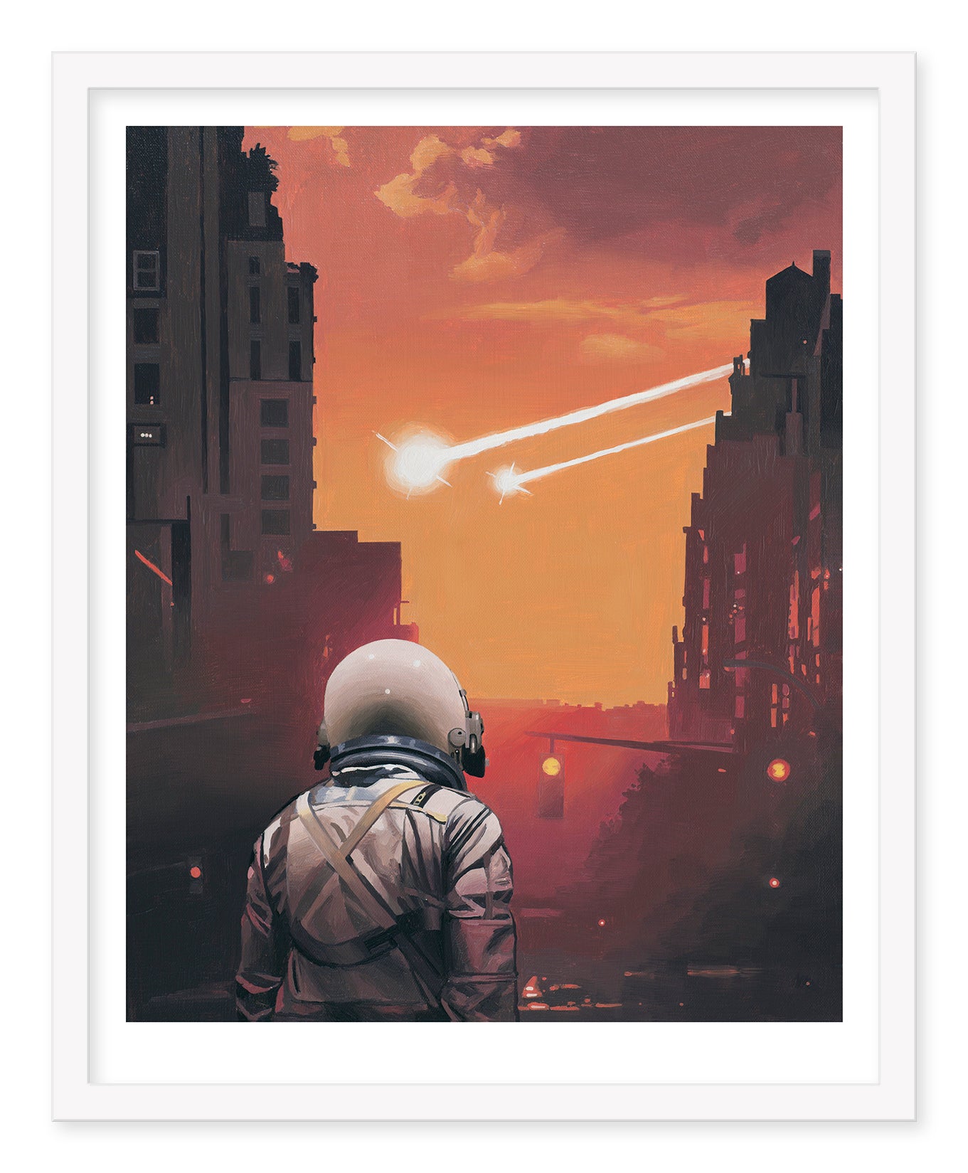 A person in a spacesuit stands on an urban street at sunset, gazing at two bright celestial objects with trailing light beams. Tall buildings silhouette the scene, adding intrigue to Two Coming In, a limited edition archival pigment print by Scott Listfield.