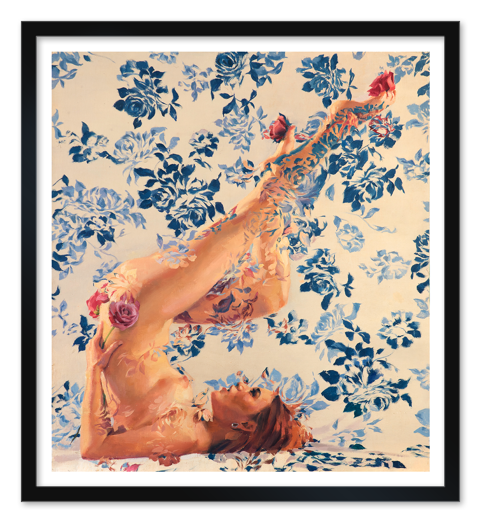 The Thisbe by Sergio Lopez is a signed, numbered limited edition of 40. It features an archival pigment print depicting a person with floral skin patterns intertwined with blue and pink flowers, seamlessly blending into the backdrop. The artwork is beautifully framed.