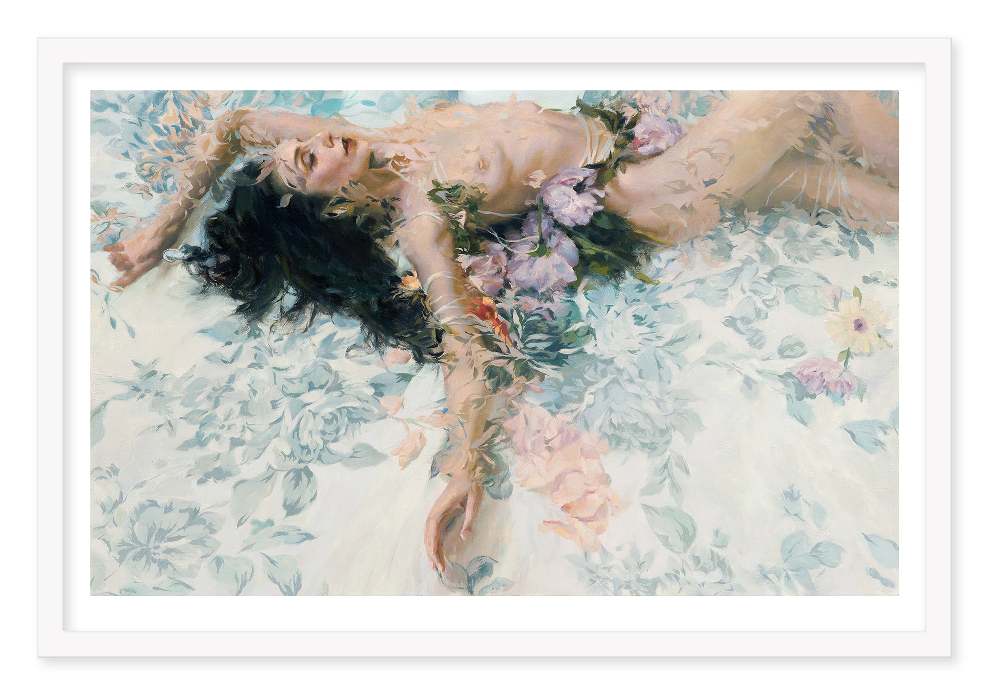 A Floribunda by Sergio Lopez depicts a person on a floral-patterned surface, framed by flowers with dark hair spread out and arms above their head. The archival pigment print blends the figure into the floral background for a dreamy effect.