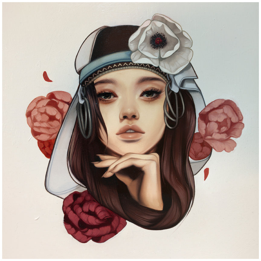 A Prison of Comfort by Kelsey Beckett is an archival pigment print featuring a woman with long brown hair, a white flower headpiece and veil, resting her hand under her chin amid red and pink flowers on a white background. This signed and numbered artwork is available for purchase.