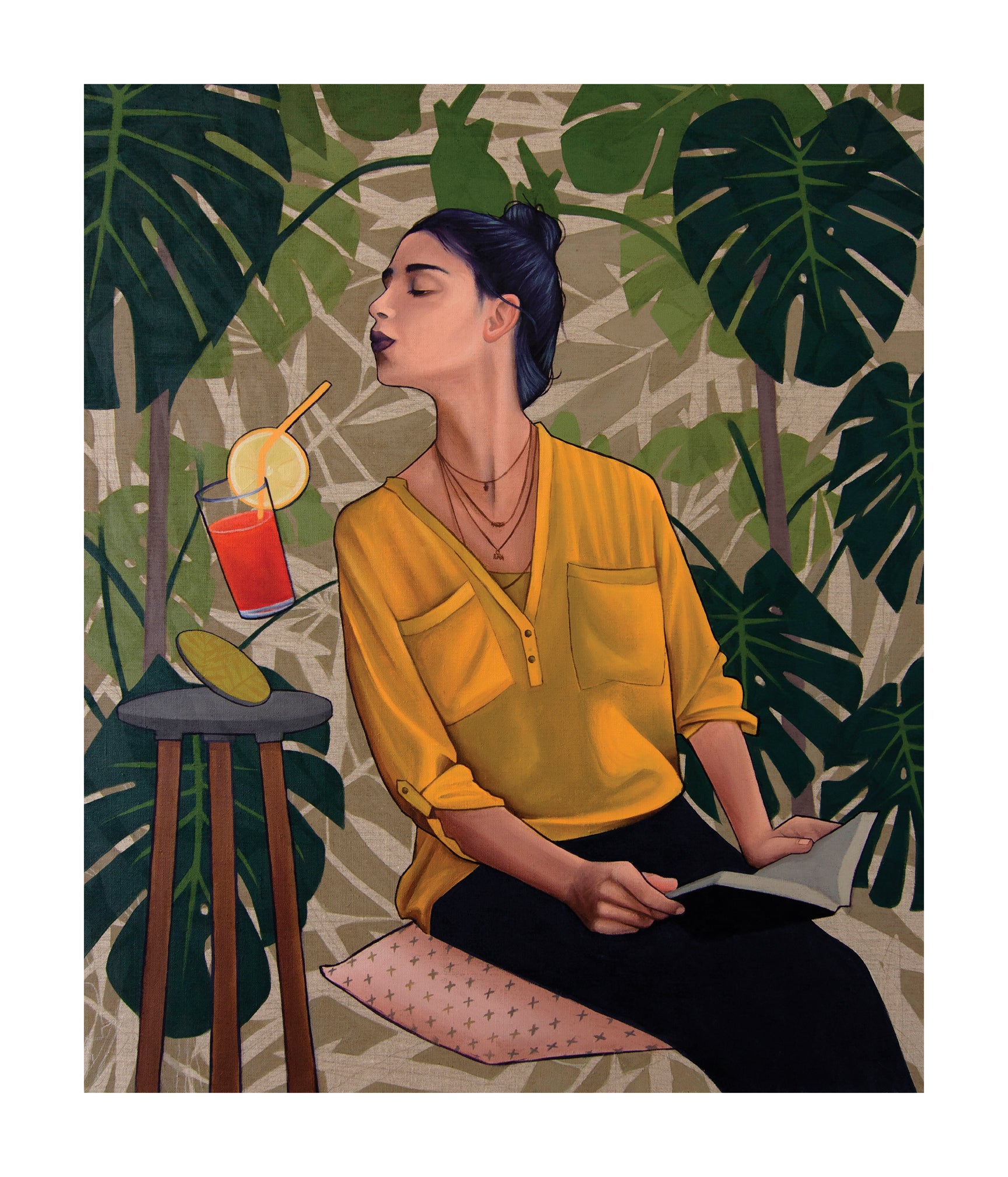 The Thirst print by Artez features a woman with dark hair in a bun, wearing a yellow blouse and reading. Beside her is a red drink with lime on the table, framed by large green leaves. This archival, hand-numbered artwork captures an enchanting moment.