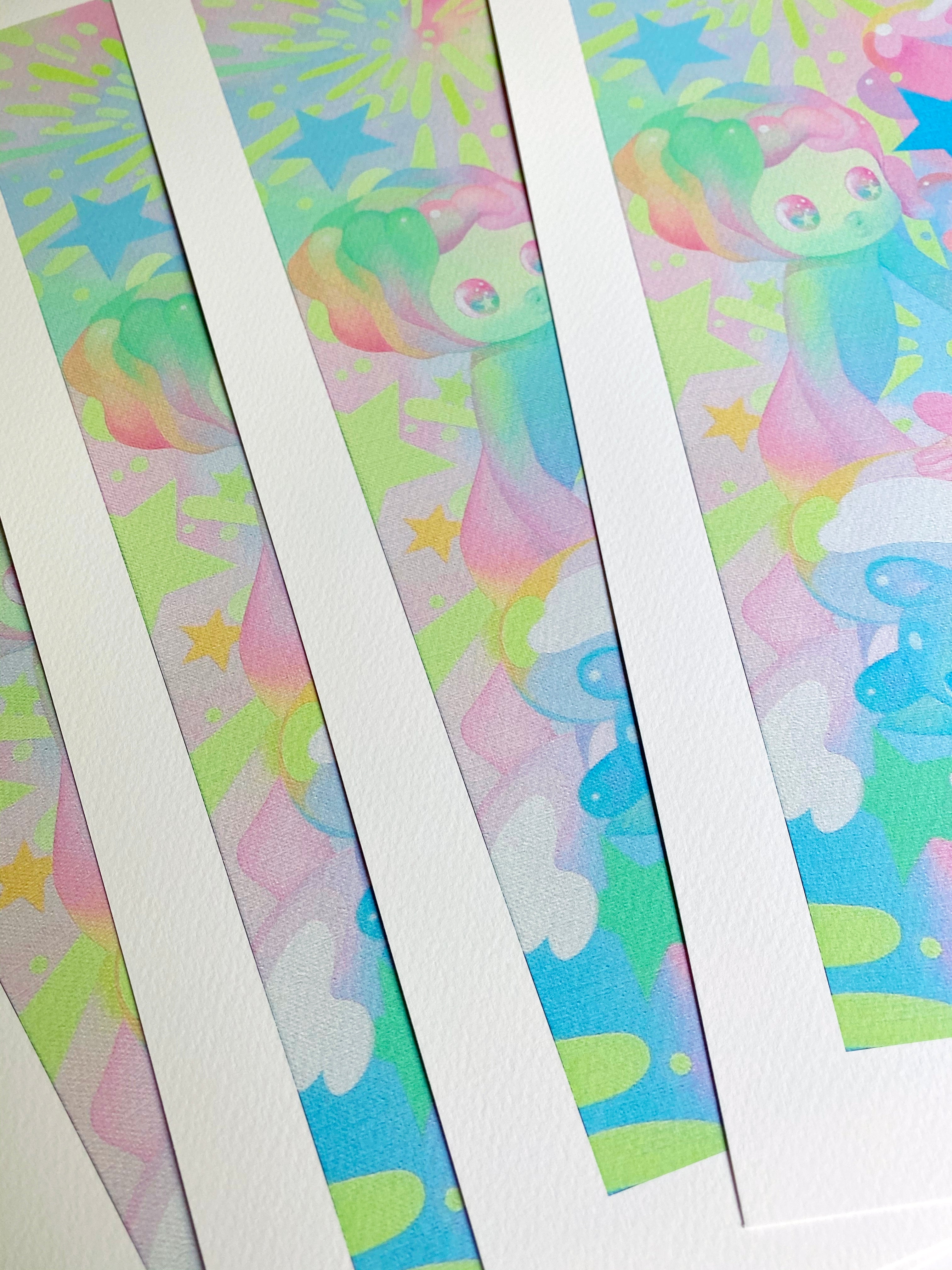 Espirit by So Youn Lee features colorful art prints with pastel designs of stars and abstract characters on textured, archival pigment paper, arranged in overlapping rows. Vibrant hues like pink, blue, green, and yellow may be hand embellished for added charm.