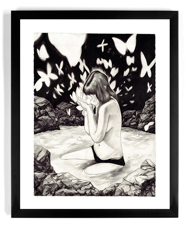 Transitions by Nimit Malavia features a person kneeling in water, surrounded by rocks and butterflies, creating a surreal scene. This piece is available as a signed and numbered fine art giclee print.