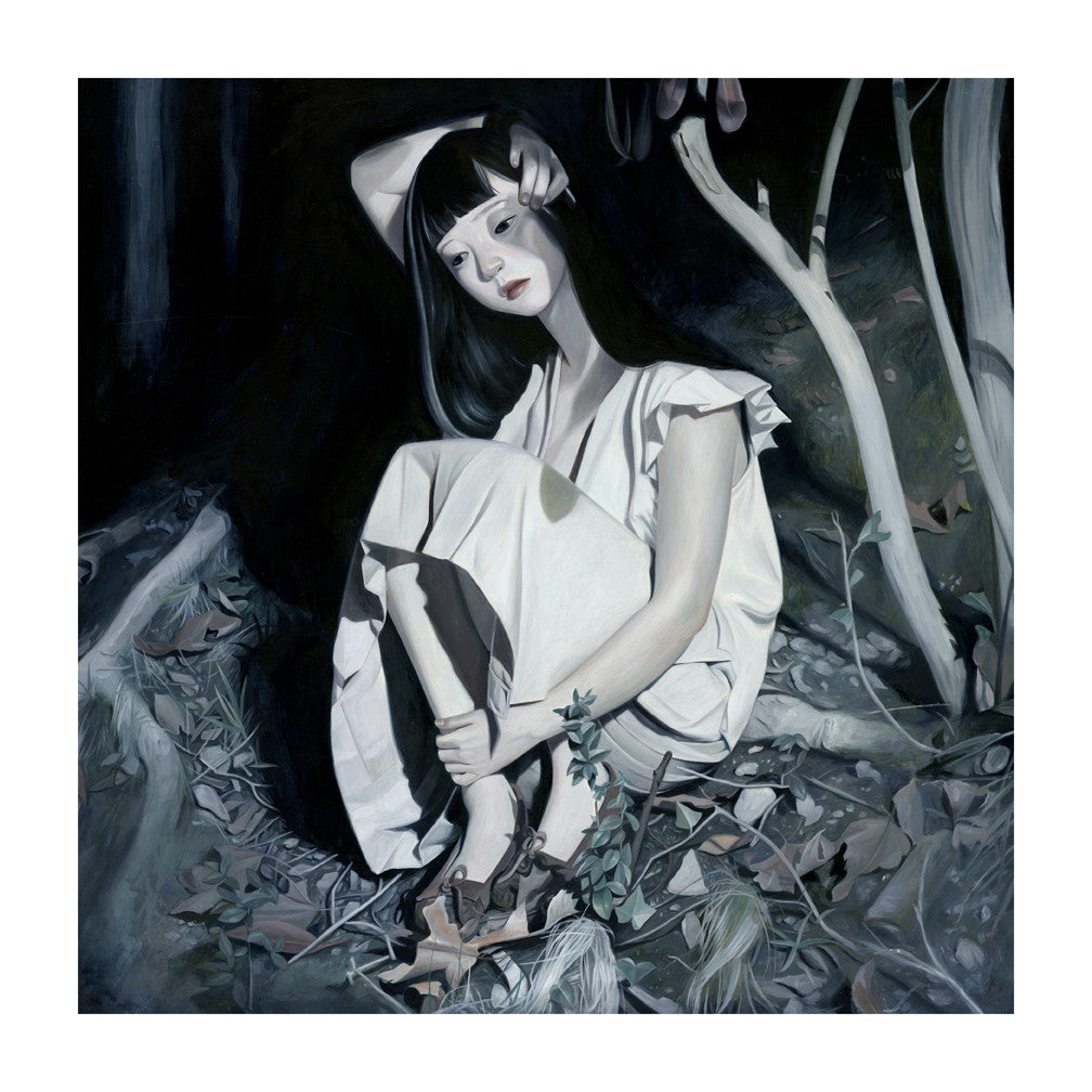 A woman with long dark hair and a pale dress sits thoughtfully on the forest floor amid leaves under dim lighting. Titled Bruise, this enchanting scene is by artist Joanne Nam and is offered as a signed and numbered fine art giclee print.