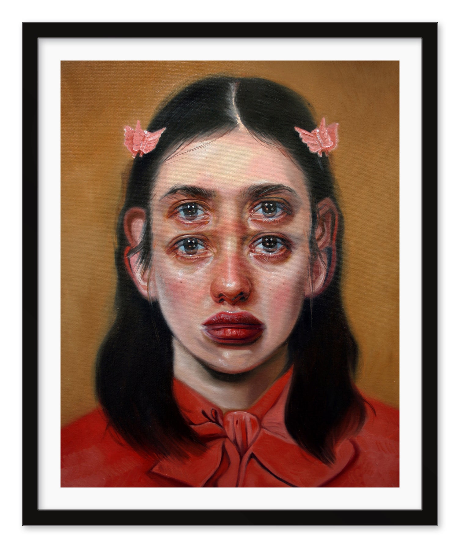 A surreal archival pigment print titled Passage by Alex Garant features a woman with long dark hair in a red outfit, adorned with pink butterfly clips. With two sets of eyes and lips, it creates a dreamlike effect against a soft brown background. The piece is signed and numbered.
