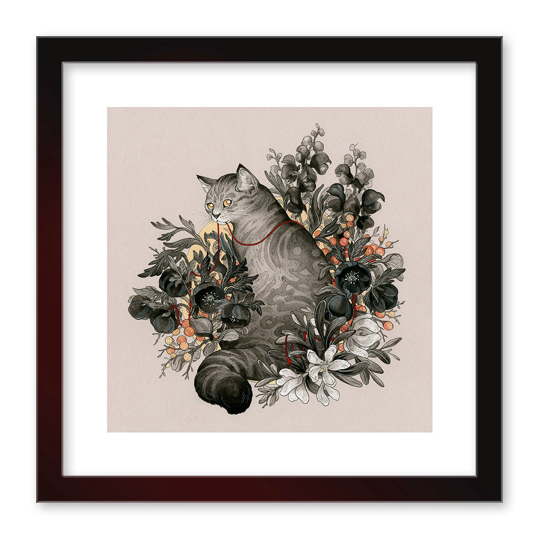 The limited edition Portent by Nicole Gustafsson is an archival pigment print of a gray striped cat amid a flower bouquet with orange and white accents, framed in black. Detailed leaves and petals encircle the cat on a neutral background.