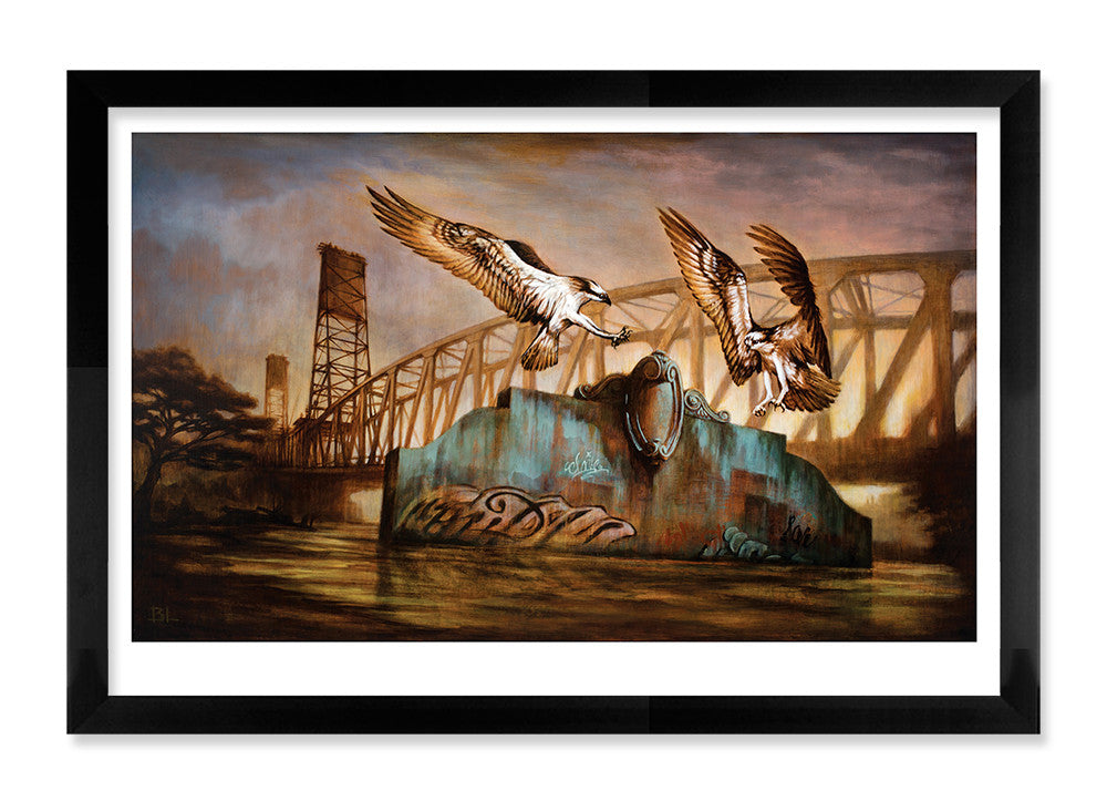 Remnants Angels by Brin Levinson depicts two ospreys flying above a graffiti-covered structure in water with a silhouetted metal bridge and cloudy sky. This limited edition fine art giclee print is framed in rich black and brown tones, capturing the drama beautifully.
