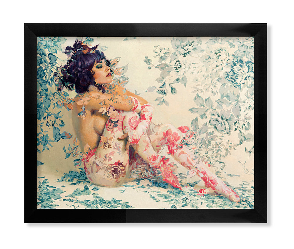 Greensleeves, a limited edition fine art giclee by Sergio Lopez, showcases a person with dark hair and a contemplative look, adorned in floral patterns that blend into a matching backdrop. The artwork envelops the figure in soft pastels and vibrant pinks, highlighting Lopezs artistic prowess.