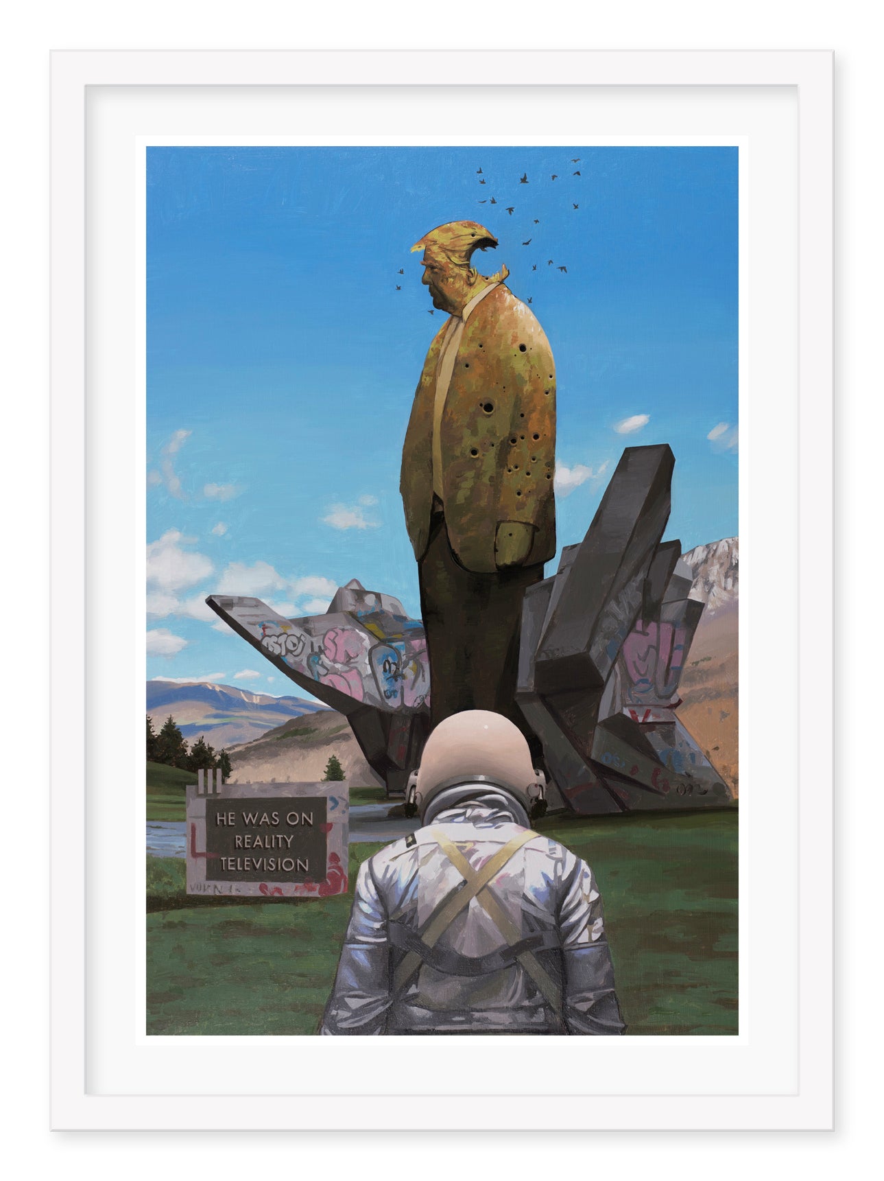 Standing before a large, weathered statue of a former president in a suit and tie, covered in birds, is an individual in a spacesuit. A sign reveals he appeared on reality television. This exquisite archival pigment print by Scott Listfield, titled Reality Television, features mountains and a clear blue sky.