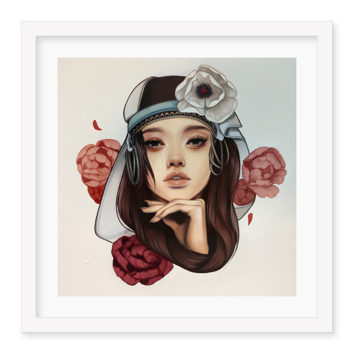 The A Prison of Comfort print by Kelsey Beckett showcases a woman with long brown hair in a white headdress adorned with a large white flower, surrounded by red and pink roses against a light background. Its available as a signed and numbered archival pigment print.